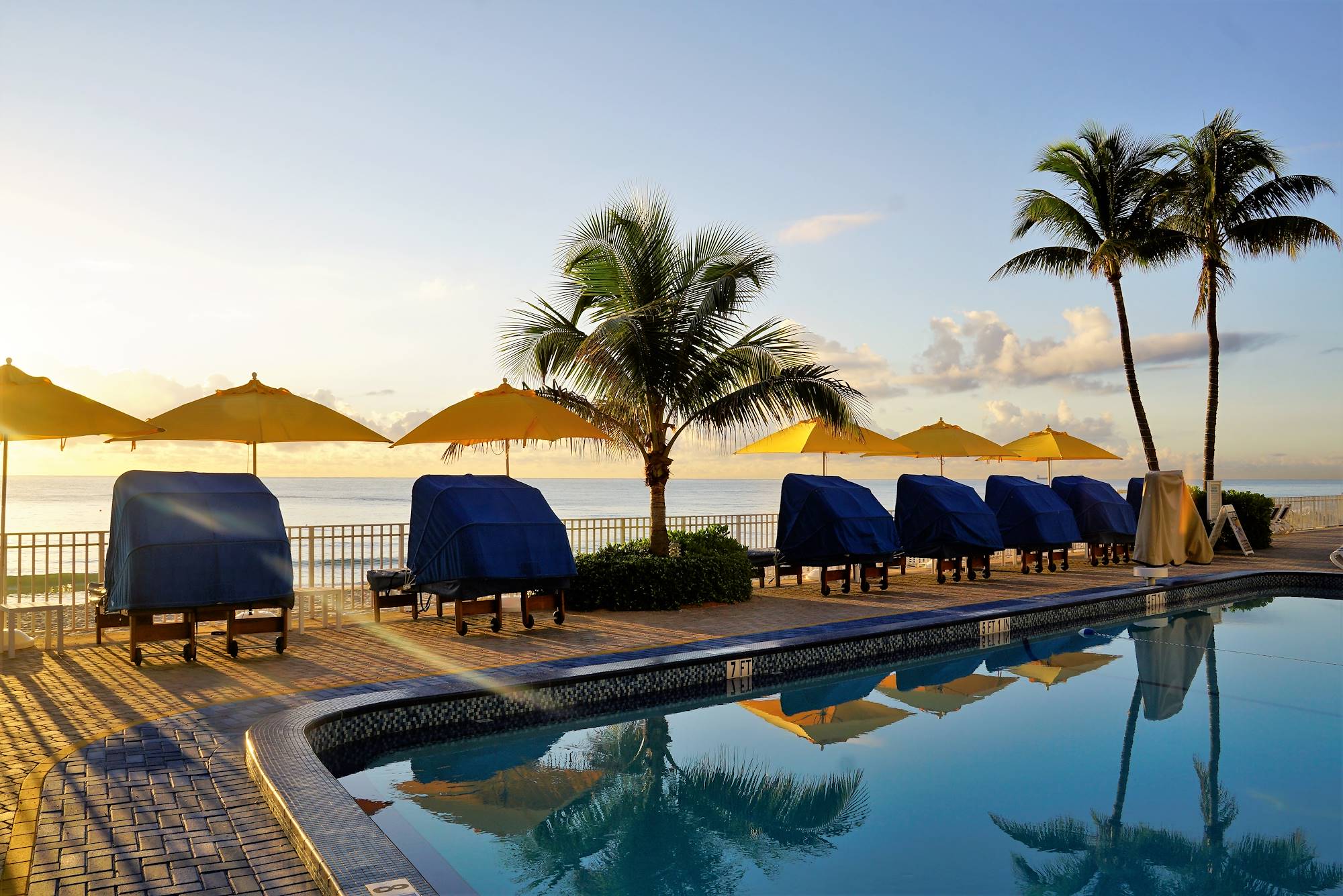 Sun bathing area by the pool at our Ft. Lauderdale Hotel